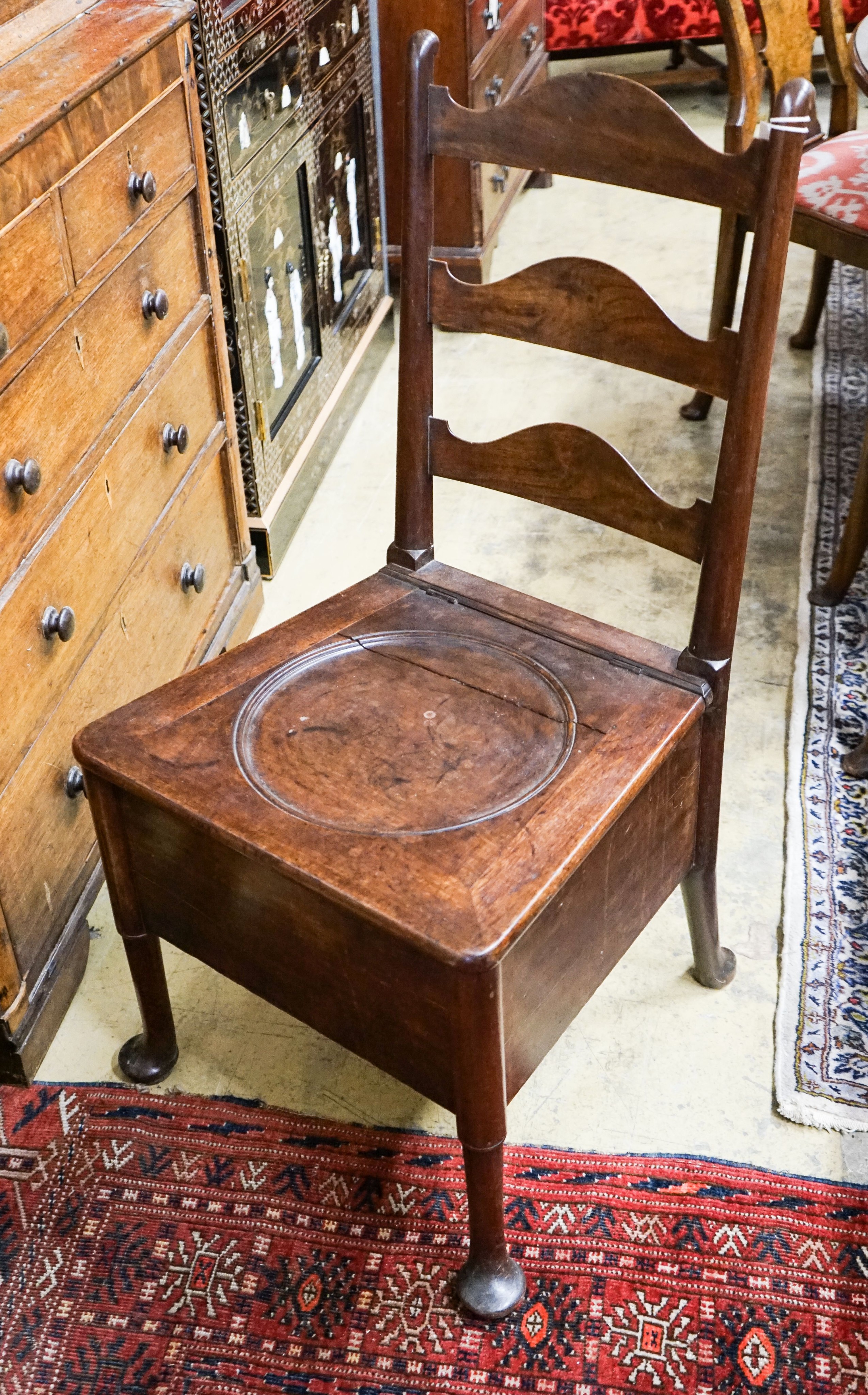 An 18th century mahogany ladderback box seat chair, width 48cm, depth 43cm, height 94cm